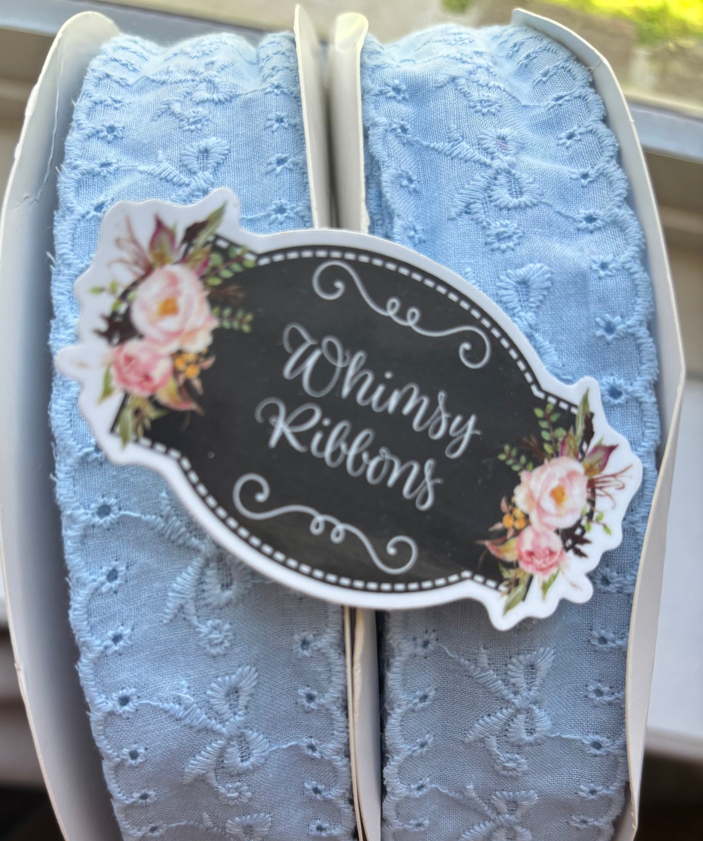 1.5 INCH light blue BOWS ON EYELET MATERIAL -1YARD