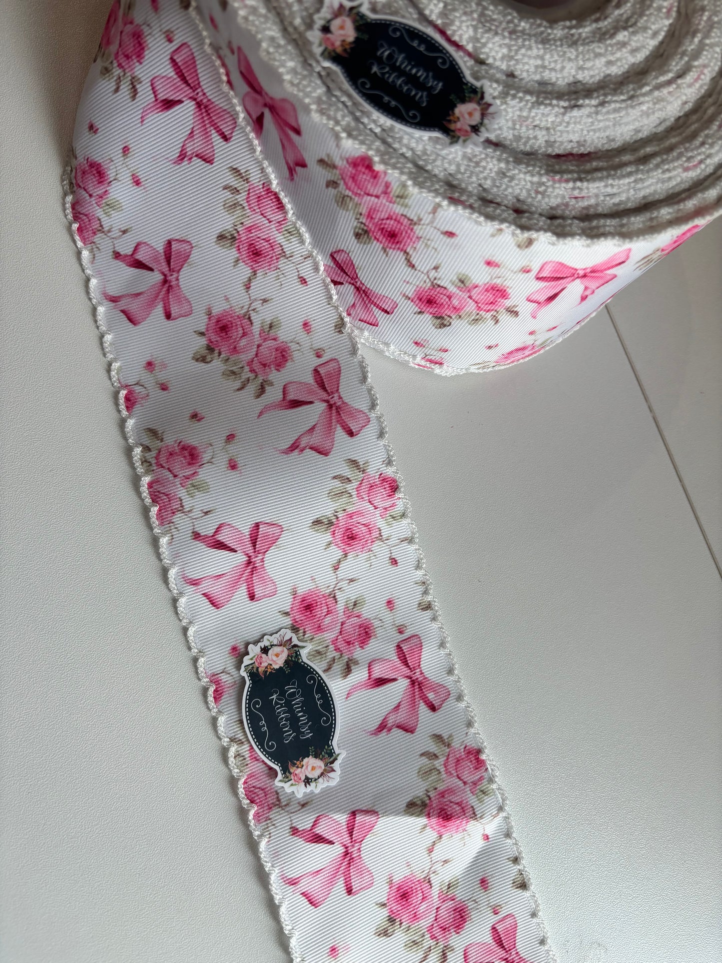 2 INCH PINK BOWS WITH FLOWERS W WHITE STITCHING MOONSTITCH RIBBON