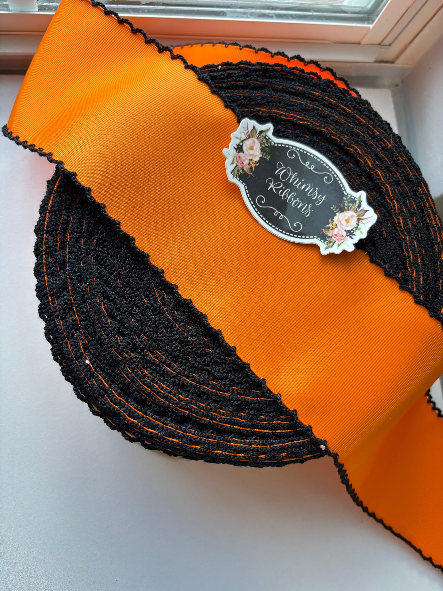 2.25 INCH ORANGE W BLACK STITCHING ribbon - 1 yard