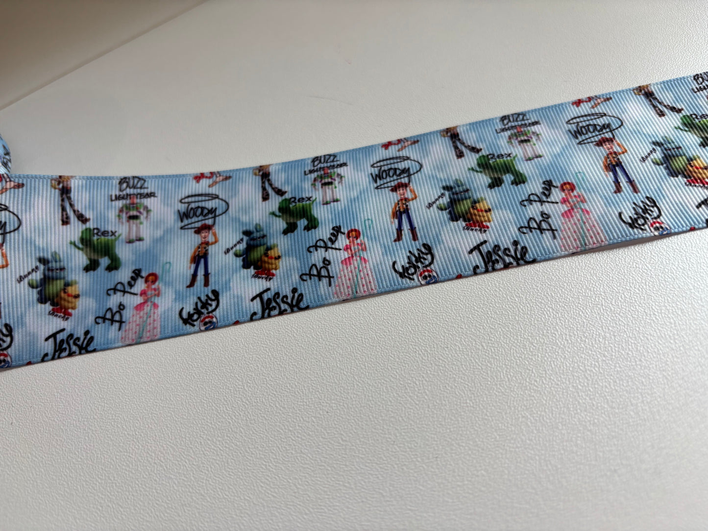 2 INCH TOY STORY  ON BLUE