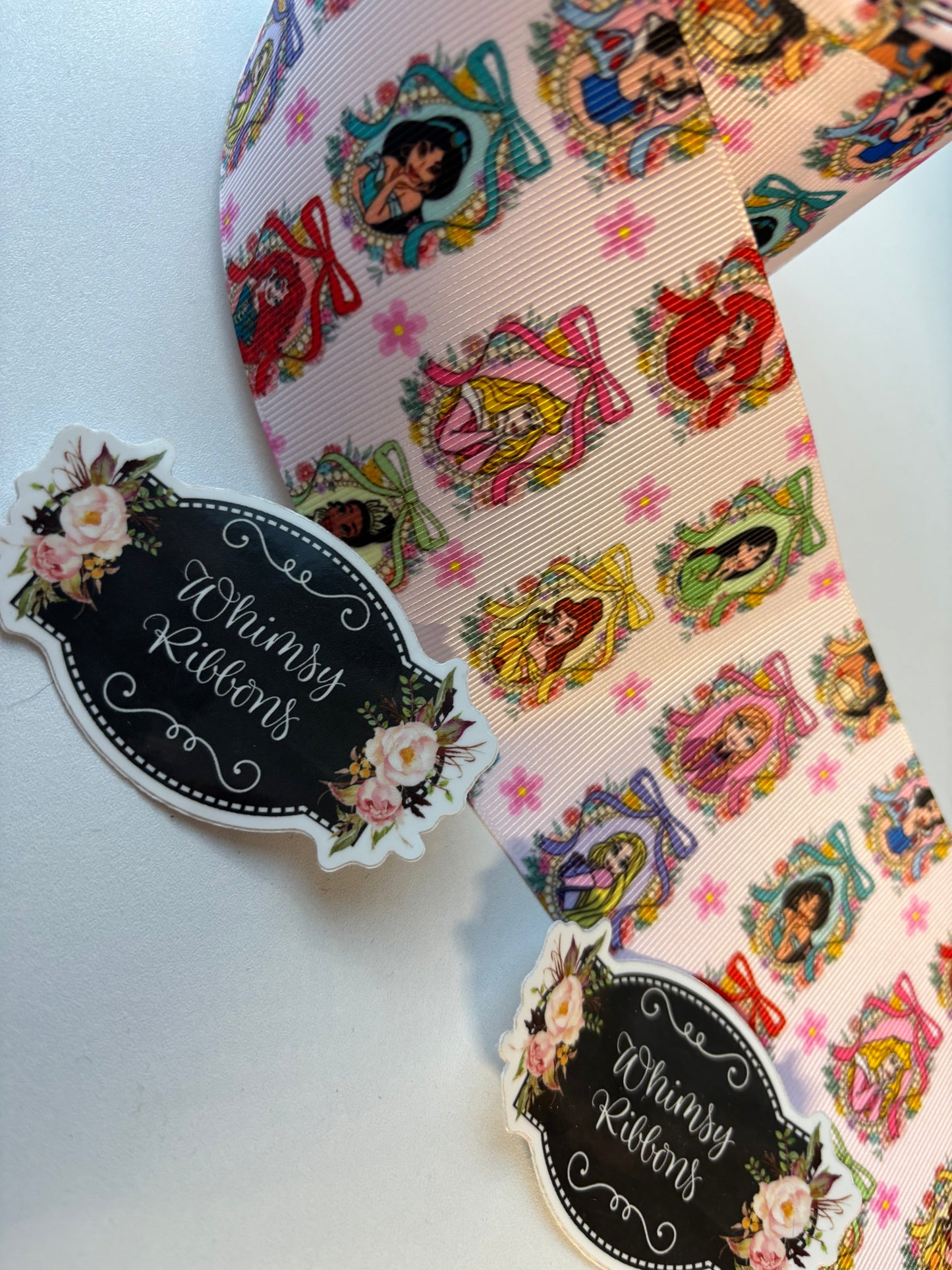 3  INCH PRINCESS ON FRAMES ON LIGHT PINK BACKGROUND RIBBON -1 YARD
