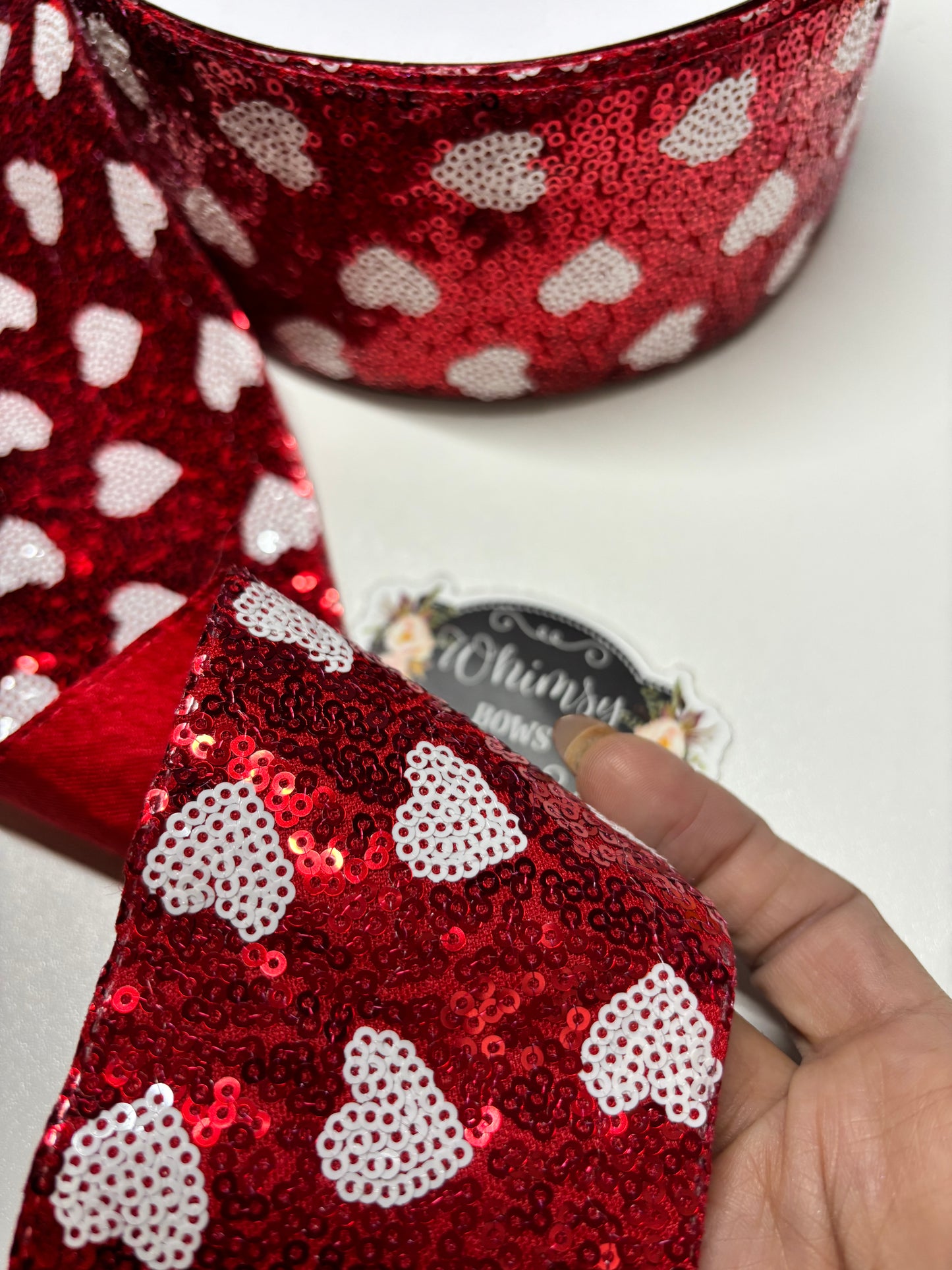 3 INCH SEQUIN WHITE HEARTS ON RED